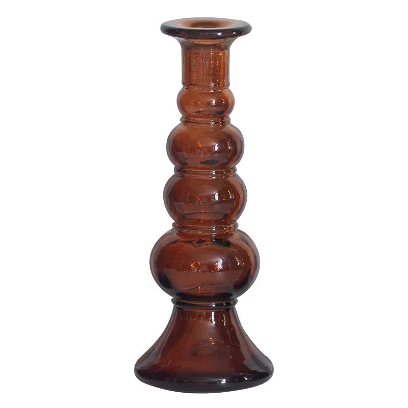 Brown glass candle holder on a white background