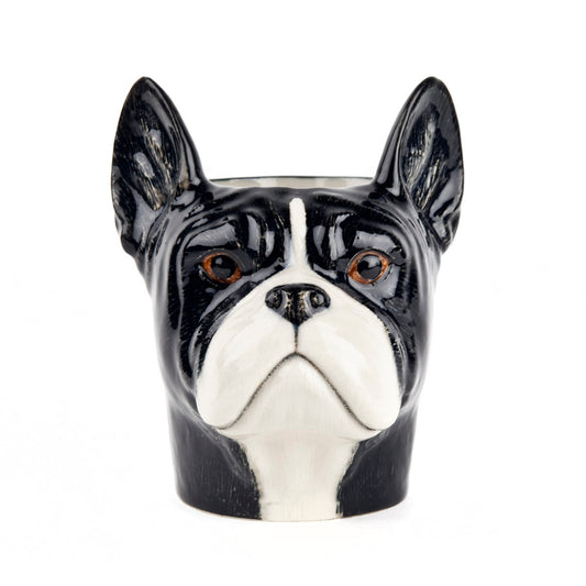 Ceramic container shaped like a black and white dog face on a white background