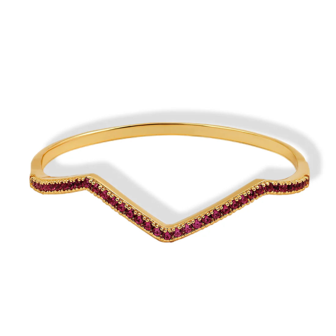 Gold ring with red gemstones on a white background