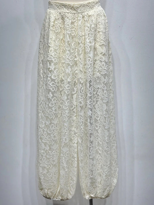 White lace pants on a mannequin against a white background