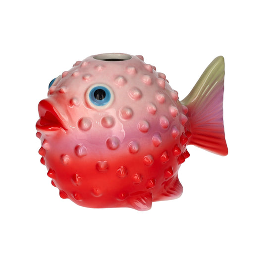Red fish-shaped toy with a textured body on a white background