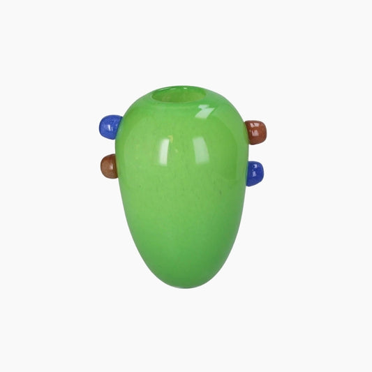 Green glass vase with brown and blue accents on a white background