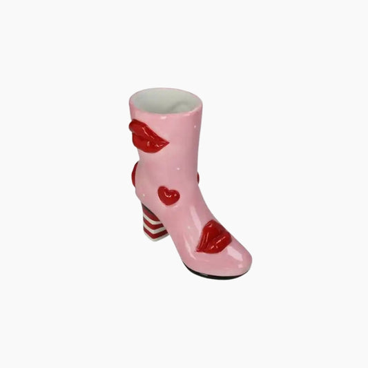 Pink ceramic boot with red hearts and stripes on a white background