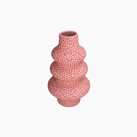 Pink textured vase on a white background