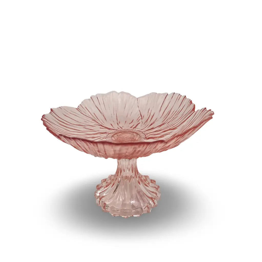 Pink glass footed bowl on a white background