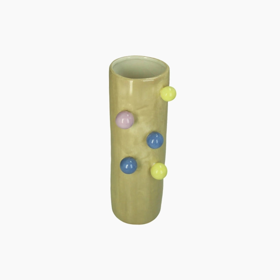 Green cylindrical vase with colorful spherical decorations on a white background
