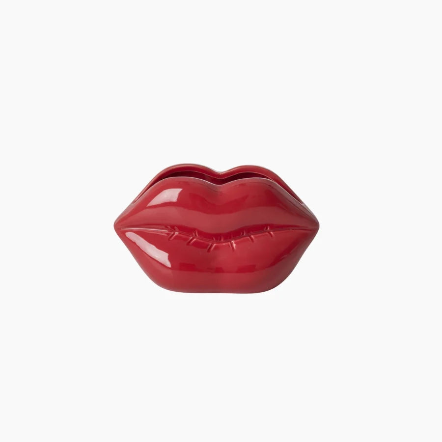 Red lip-shaped container on a white background