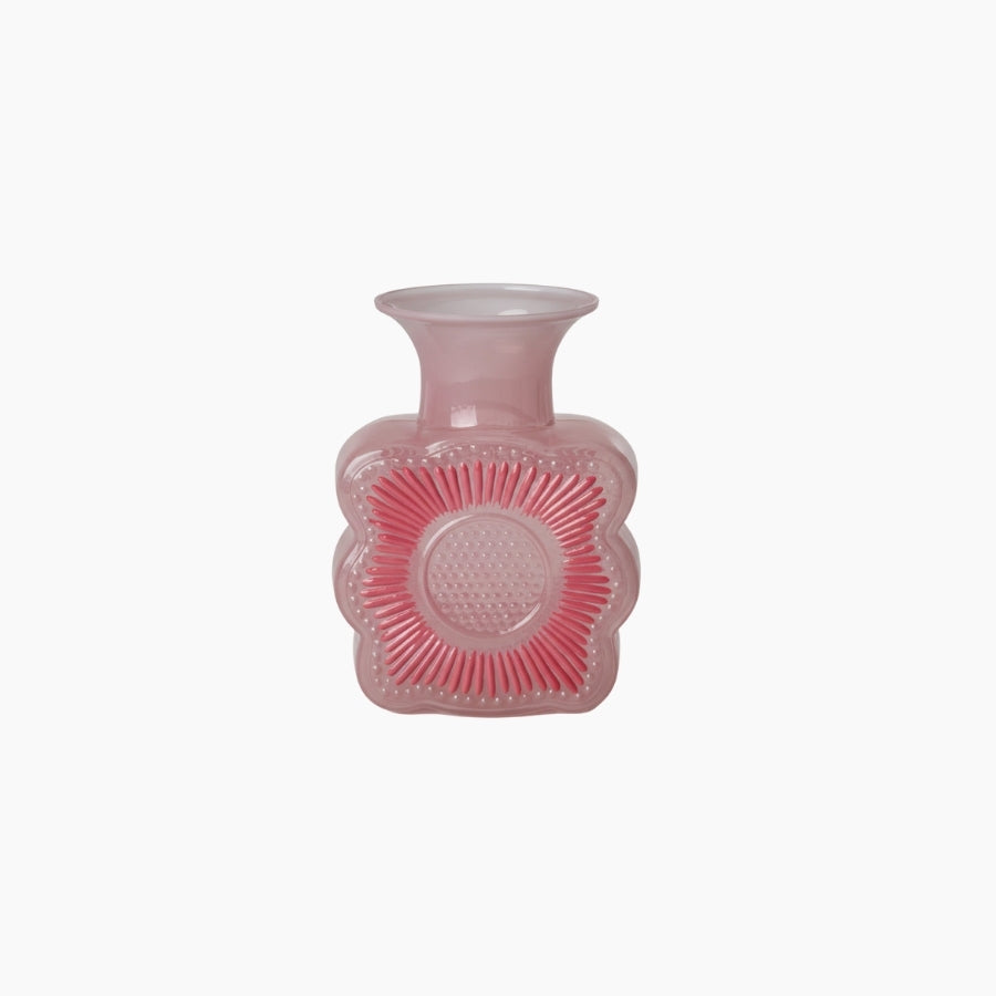 Pink textured vase on a white background