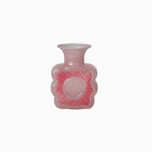 Pink textured vase on a white background
