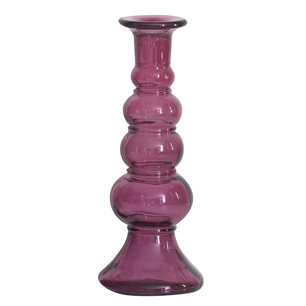 Purple glass candle holder on a white background