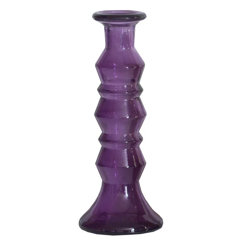 Purple glass candle holder on a white background