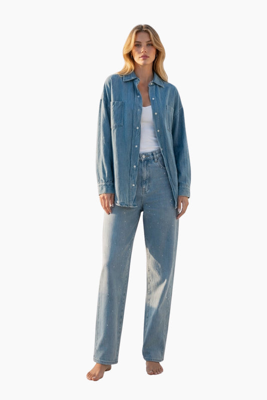 Woman wearing a blue denim outfit on a white background