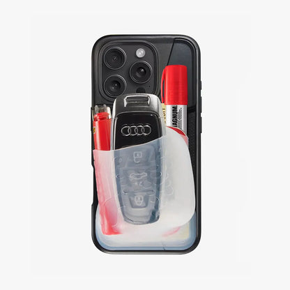Phone case with Audi car key and markers on a white background