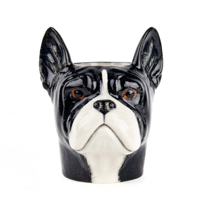 Ceramic container shaped like a black and white dog face on a white background
