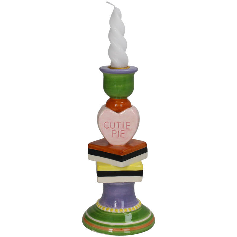 Colorful candle holder with a heart-shaped sign saying 'Cutie Pie'