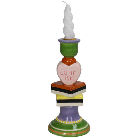Colorful candle holder with a heart-shaped sign saying 'Cutie Pie'