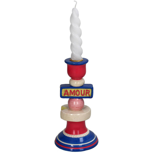 Colorful candle holder with a spiral candle on a white background