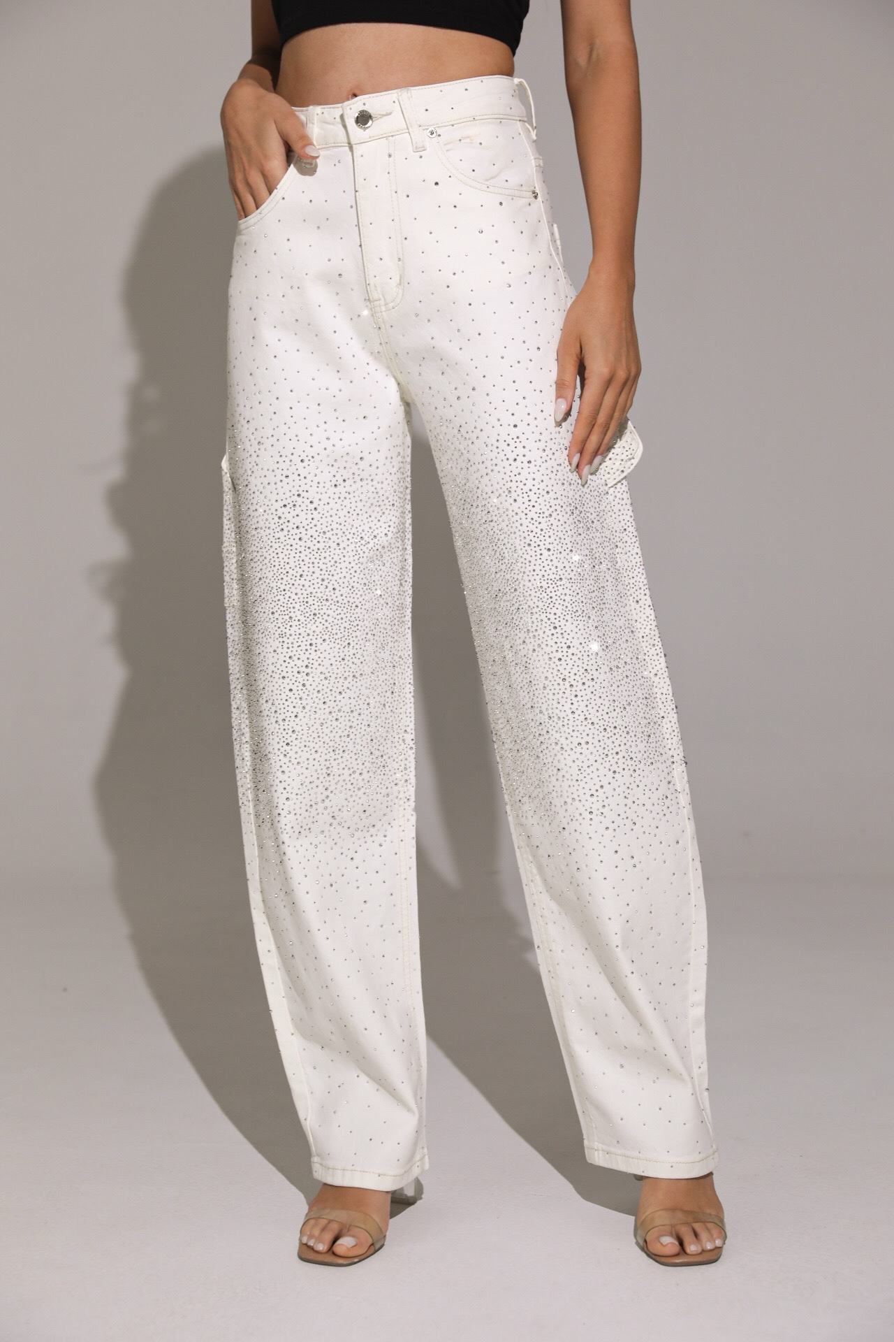 White patterned pants worn by a person on a plain background