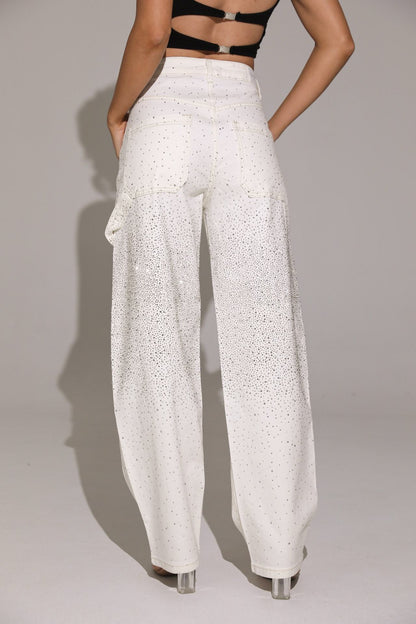 White wide-leg pants worn by a person on a plain background