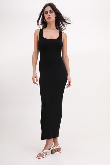 Woman wearing a black sleeveless dress on a white background