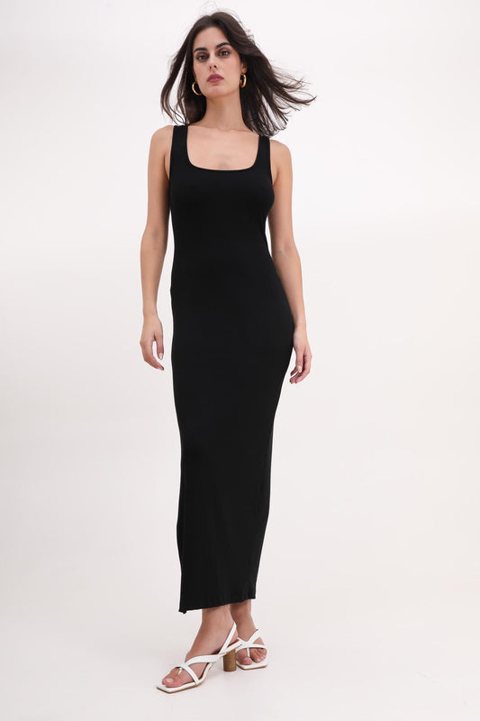 Woman wearing a black sleeveless dress on a white background