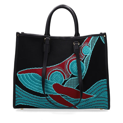 Black handbag with blue and red abstract design on a white background