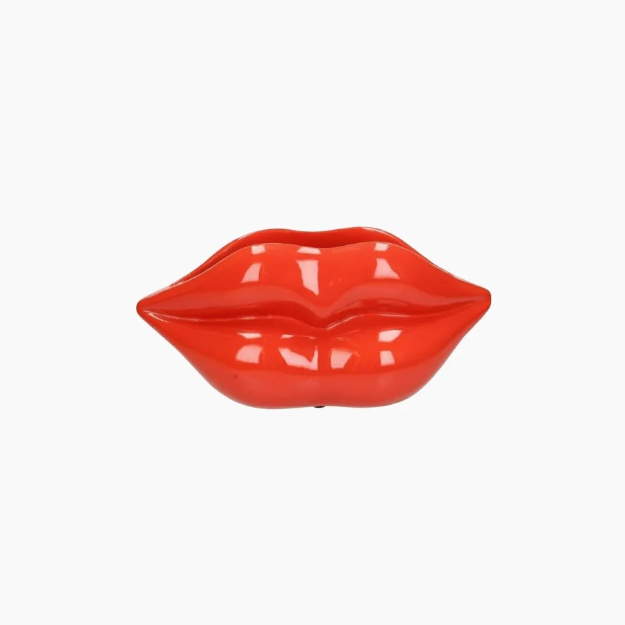 Red lip-shaped object on a white background