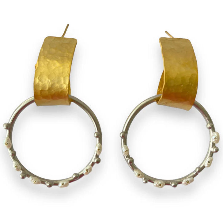 Gold hoop earrings with textured gold ends on a white background