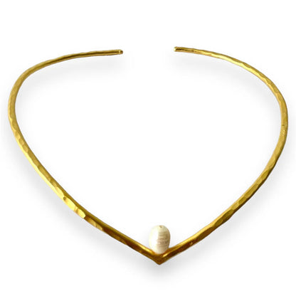 Gold necklace with a white pearl on a white background