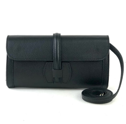 Black leather clutch bag with strap on a white background