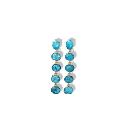 Pair of turquoise drop earrings on a white background