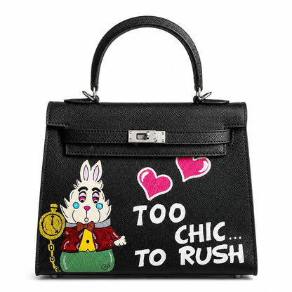 Black handbag with cartoon character and text 'Too Chic... To Rush' on a white background