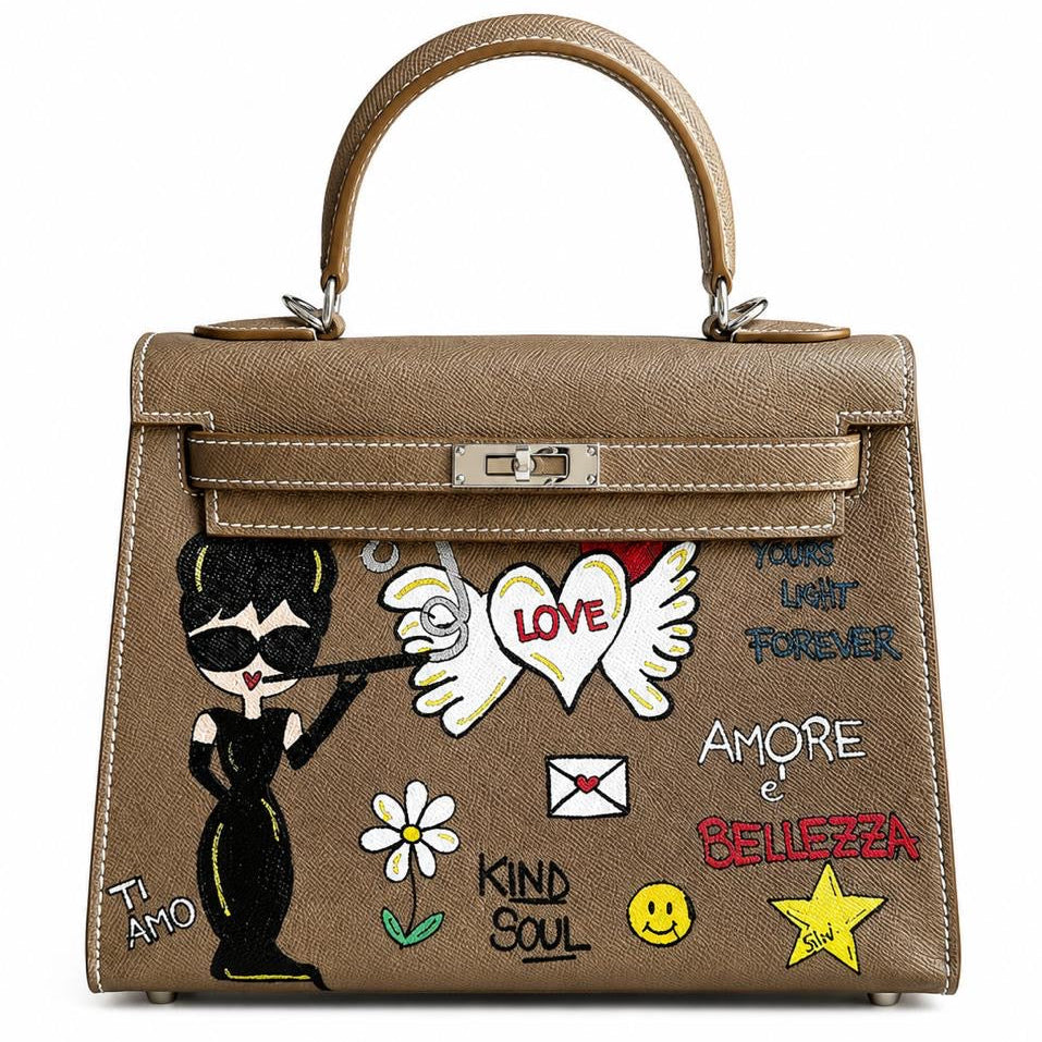 Brown handbag with various patches and designs on a white background