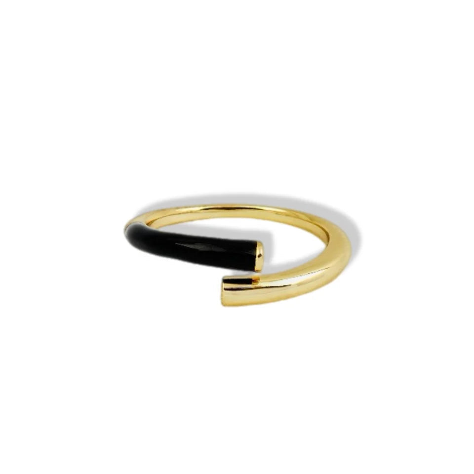 Gold and black ring on a white background