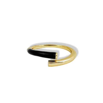 Gold and black ring on a white background