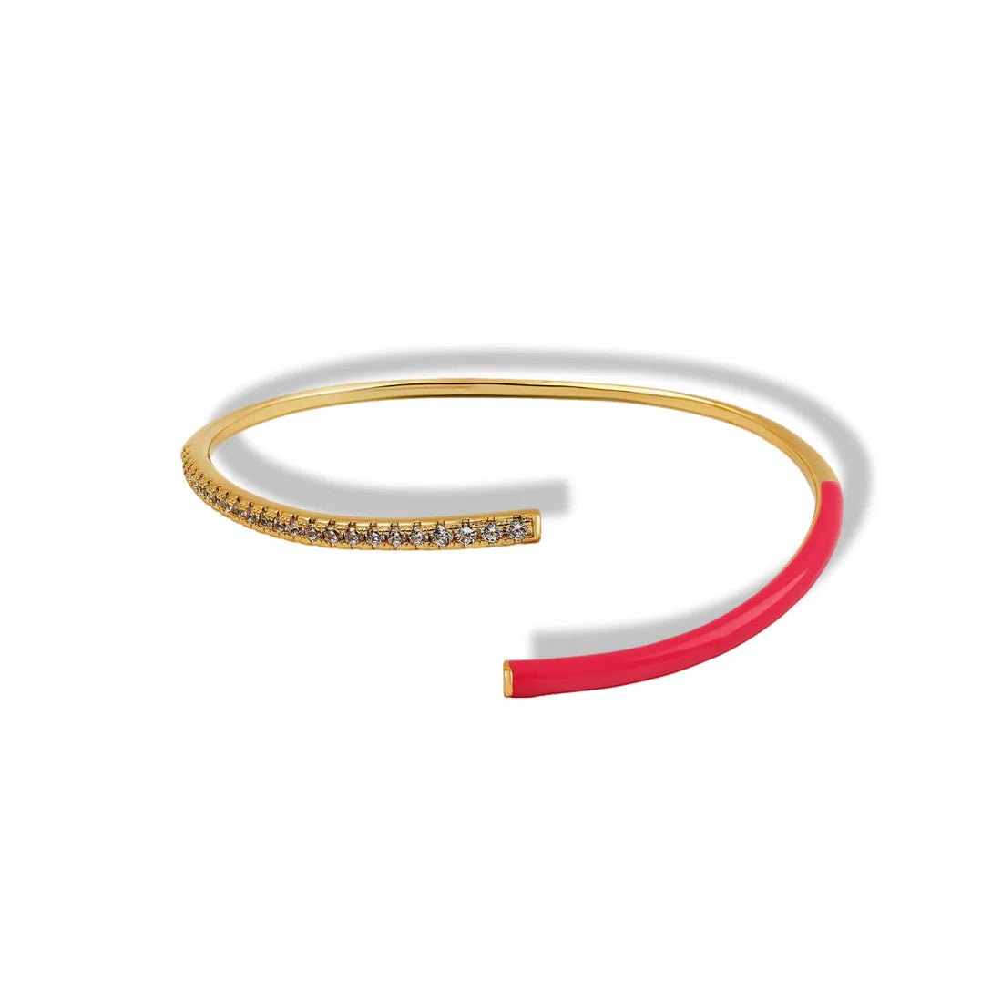 Bangle with gold and red accents on a white background