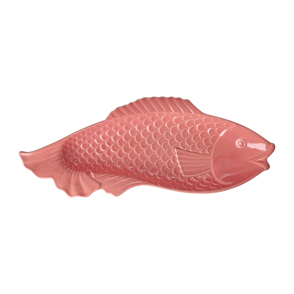 Pink fish-shaped object on a white background