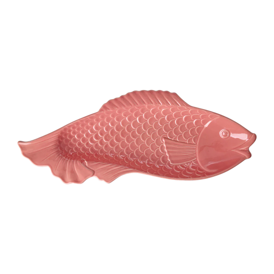 Pink fish-shaped object on a white background