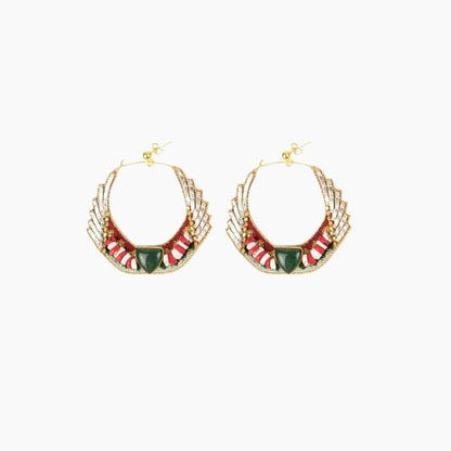 Pair of gold hoop earrings with red and green accents on a white background