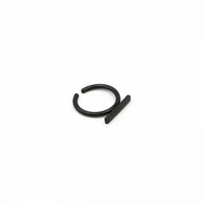 Black metal clip on earring on a white background