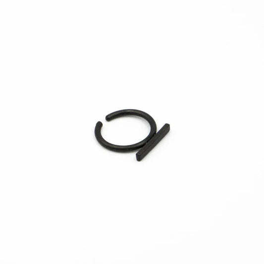 Black metal clip on earring on a white background