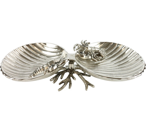 Silver clam shell dish with a central crab on a white background