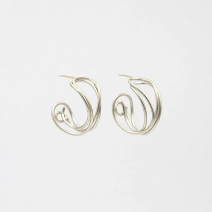 Pair of silver hoop earrings on a white background
