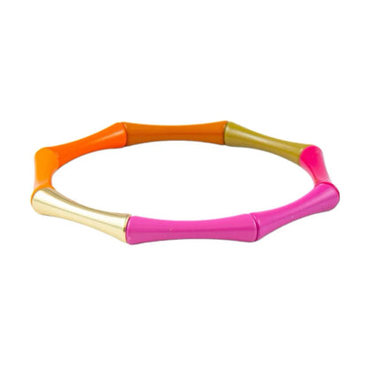 Neon orange, gold, and pink tube toy on a white background