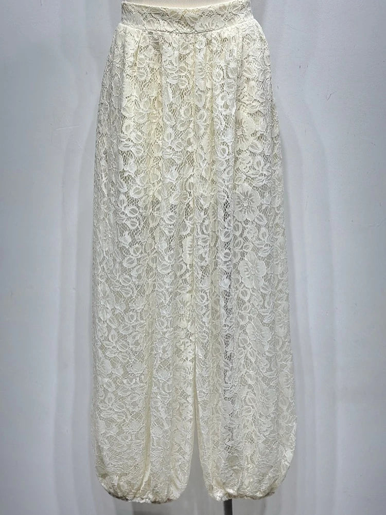 White lace pants on a mannequin against a white background