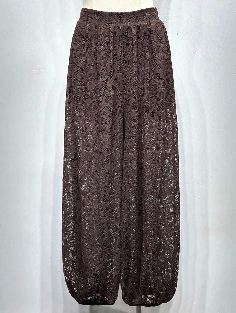 Brown lace pants on a mannequin against a white background