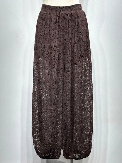 Brown lace pants on a mannequin against a white background