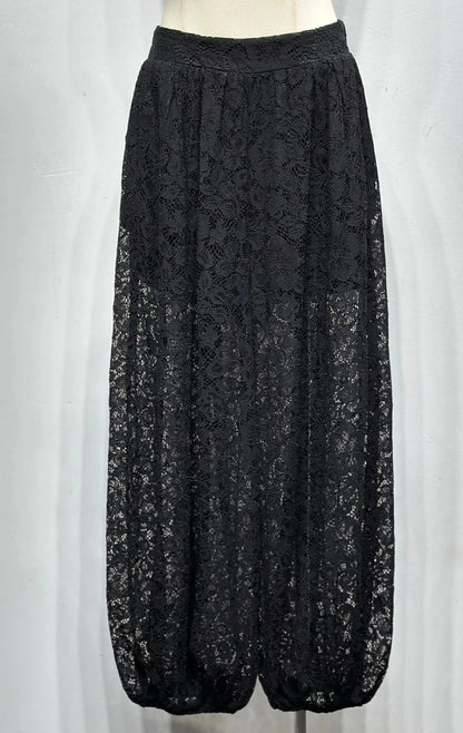 Black lace pants on a white mannequin against a white background