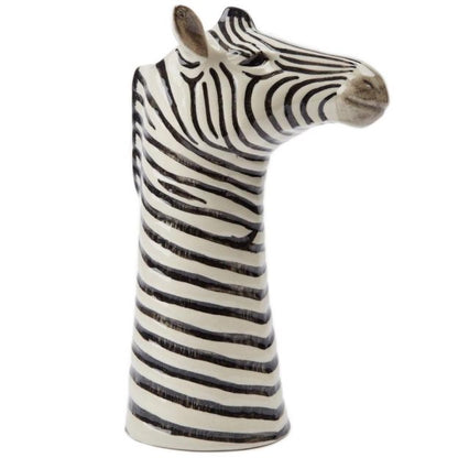 Zebra head sculpture with black and white stripes on a white background