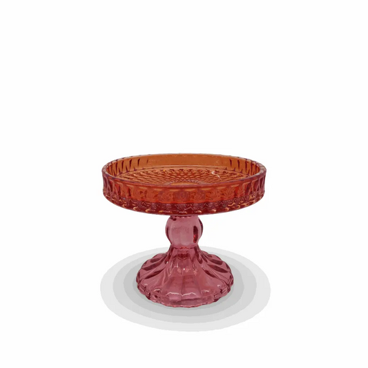 Red glass compote on a white background